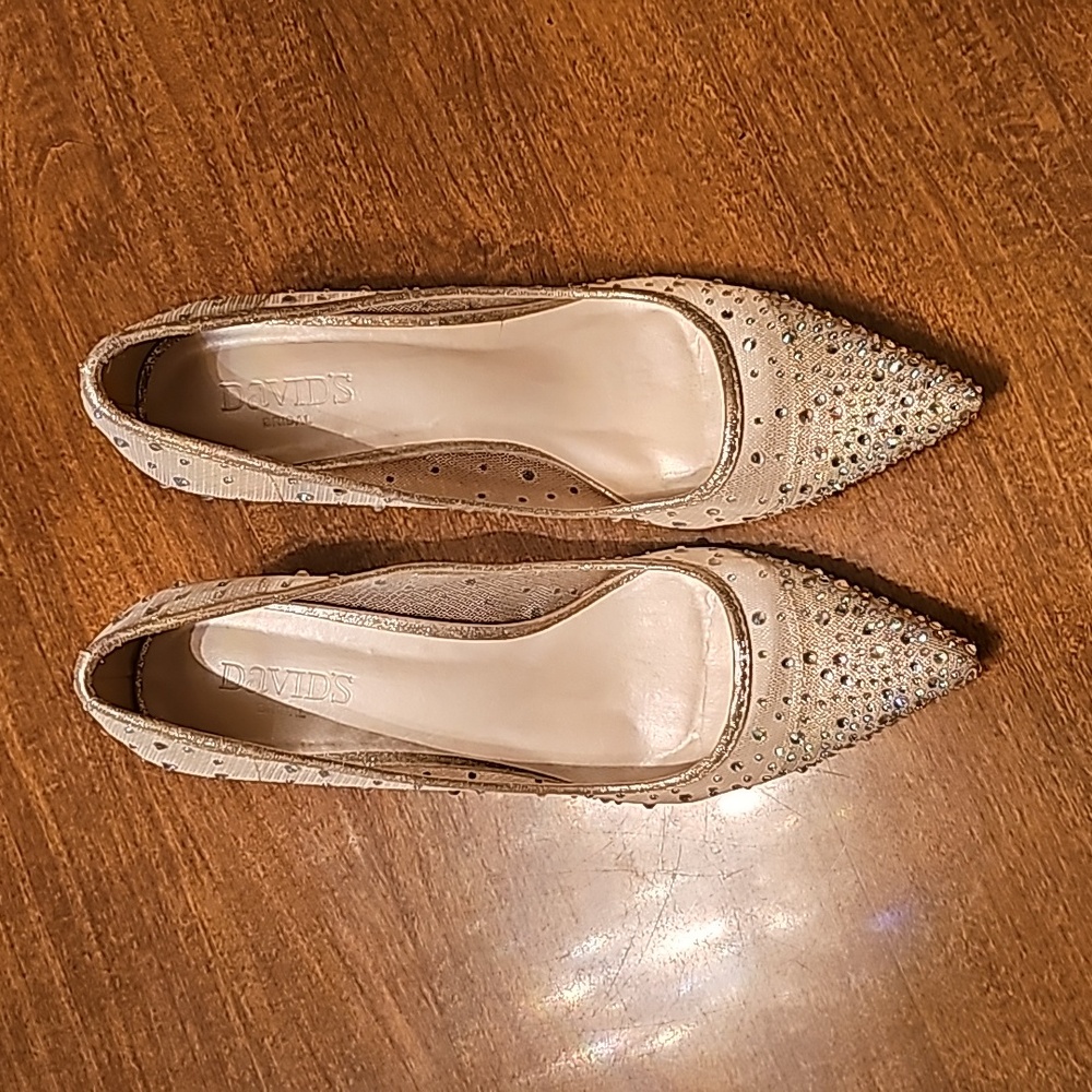 This is a pair of glamorous David's Bridal rhinestone dress shoes nude size 8.5